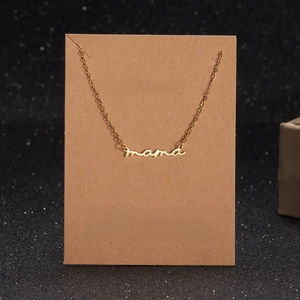 Detail of gold Mama letter pendant on a Make A Wish gift card for Mother's Day