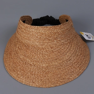 Macro detail of breathable raffia straw sun visor hat with flexible black elastic band