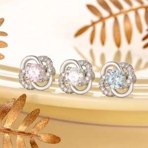Elegant silver four-leaf clover stud earrings with pink white and blue zircon stones