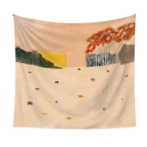 Detail of bohemian tapestry featuring wild animals and nature scene in warm tones