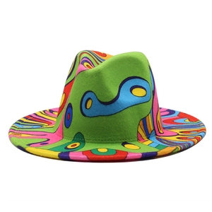 Detailed view of colorful graffiti art texture on neon green wide brim wool fedora hat