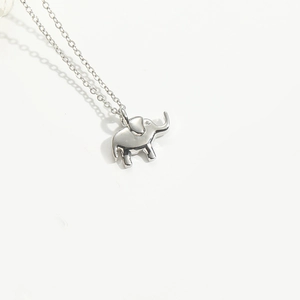 Detailed view of silver minimalist elephant pendant on a fine O-link chain necklace