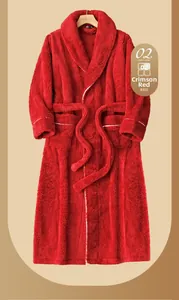 Detailed close-up of thick carmine red plush fleece bathrobe with belt and white piping