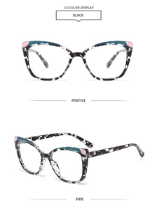 Cat-eye glasses frame featuring black and white mottled textures with colored corner accents