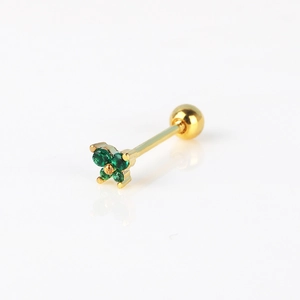 Detailed macro of gold butterfly cartilage stud with four green zircon stones and screw back