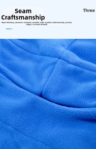 Close-up of blue polar fleece fabric showing neat stitching and durable edge finish