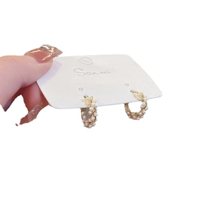 Elegant gold hoop earrings with small white faux pearls for women stylish fashion accessory