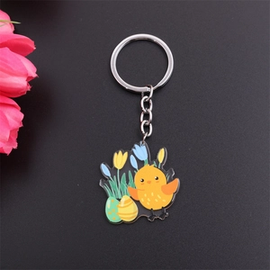 Cartoon Easter keychain featuring a yellow chick, colorful egg, and flower charms