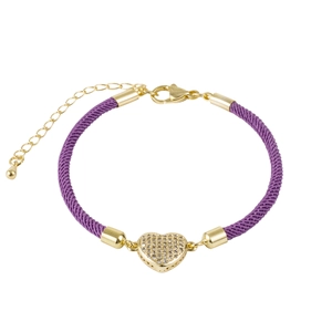Detail of purple braided bracelet featuring a gold heart charm with cubic zirconia