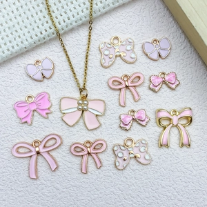 Pink enamel bow charms and golden necklace pendants set for DIY jewelry making