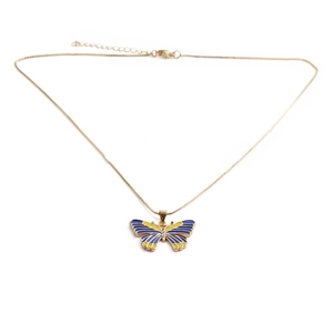 Detail of a gold-tone butterfly pendant with blue and yellow enamel inlay work