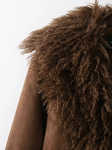 Close-up of brown faux fur collar and suede texture on women's winter jacket