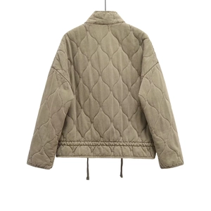 Rear view of quilted cotton jacket in olive green featuring diamond texture and drawstring hem