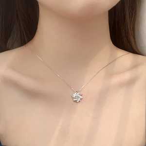 Elegant S925 sterling silver windmill necklace with sparkling moissanite on model