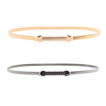 Detail of gold and black elastic metal waist chains with woven texture buckle for dresses