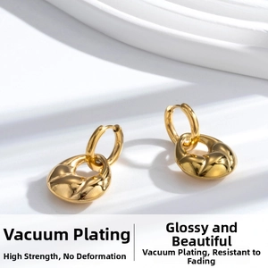 Macro shot of high-quality vacuum-plated gold croissant hoop earrings in titanium steel
