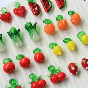 Colorful assorted glass fruit pendants for DIY jewelry making including watermelon and citrus