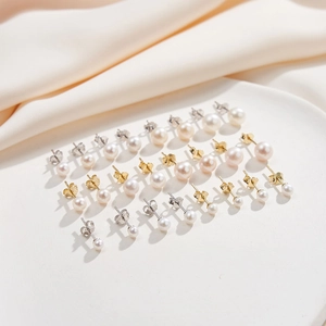 Close-up of assorted natural freshwater pearl earrings in gold and silver finishes