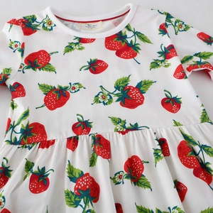 Girl's knit cotton dress with vibrant red strawberry pattern and classic pleated waist