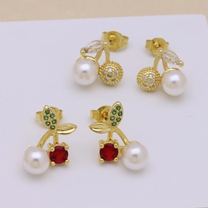 Elegant cherry-shaped earrings with pearls and red gemstones on a white background