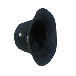 Classic black reversible bucket hat with white daisy embroidery for outdoor sun protection