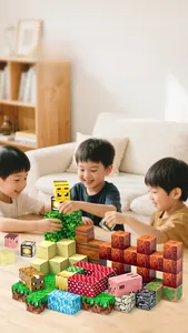 Children playing with magnetic pixel blocks featuring grass and animal textures