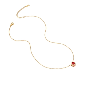 Elegant gold stainless steel necklace with a round red zircon pendant on a white background