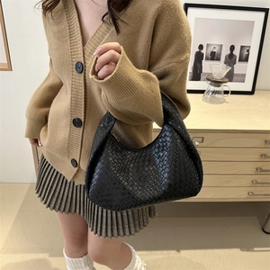 Fashionable black woven hobo bag for women with unique knot handle in a casual style