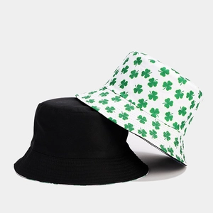 Reversible clover pattern bucket hat in black and white green print for women