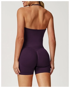 Detail of plum seamless yoga vest and scrunch shorts back view showing stretch knit fabric