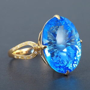 Luxury oval Swiss blue topaz ring with nest cut and gold-plated diamond pavé band