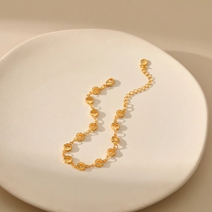Elegant 18K gold-plated hollow flower chain bracelet with adjustable lobster clasp