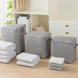 Three houndstooth storage bags for quilts and clothes in various sizes for home organization