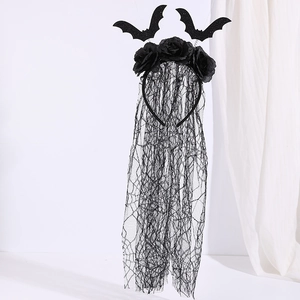 Detail of Halloween headband with black roses, glittery bats, and long lace veil