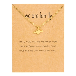 Golden chain necklace with heart and arrow pendant displayed on a sentiment card