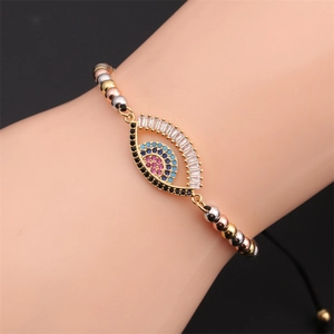 Detail of adjustable evil eye bracelet featuring colorful zircons and tricolor metal beads