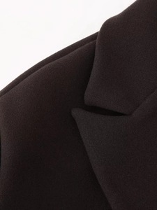Close-up of the professional lapel collar and fine texture of the woolen jacket