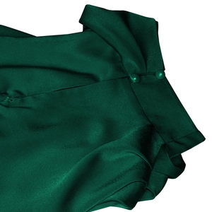 Detail of dark green satin dress showing elegant neckline with button and pleated shoulder