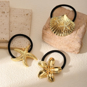 Three-piece minimalist gold metal hair ties set featuring shell, starfish, and flower designs
