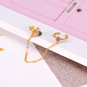 Detail of 18K gold chain earring with colorful zircon stones and ear cuff connector