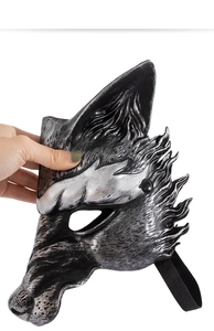 Detail of silver and black wolf mask with realistic fur texture and elastic band for party