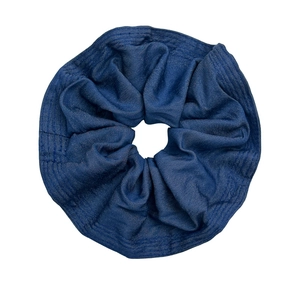 Vintage blue denim scrunchie with ruffled skirt design for high-end bun hairstyles