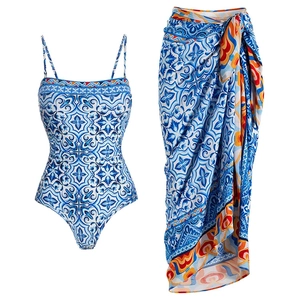 Blue and white floral print one-piece swimsuit with matching sarong cover-up set