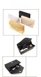 Detail showing various colors and spacious interior capacity of the satin evening clutch
