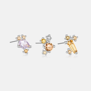 Detailed macro view of S925 silver stud set with colorful teardrop and geometric zircons