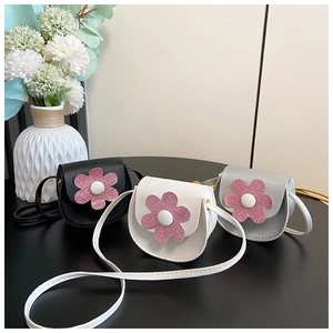 Detailed group view of mini floral crossbody bags in black, white and silver PU leather