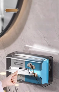 Detail of wall-mounted dark gray tissue box showing easy paper extraction on marble wall