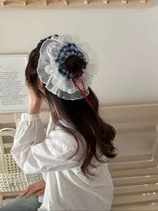 Rear view of a blue checkered scrunchie with lace details and red ribbons on hair