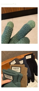 Detailed view of thick knit gloves with touchscreen tips and warm label on wood