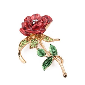 Elegant vintage sunflower brooch with red enamel petals and crystals on a golden stem